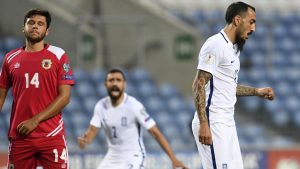 Greece's forward Kostas Mitroglu (R) walks after scoring the opening during the WC 2018 football qualification match between Gibraltar and Greece at the Algarve stadium in Faro September 6, 2016. / AFP / FRANCISCO LEONG        (Photo credit should read FRANCISCO LEONG/AFP/Getty Images)