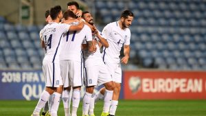Greek players celebrate after scoring a goal during the WC 2018 football qualification match between Gibraltar and Greece at the Algarve stadium in Faro September 6, 2016. / AFP / FRANCISCO LEONG        (Photo credit should read FRANCISCO LEONG/AFP/Getty Images)